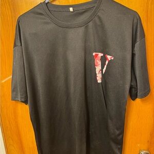 Kids small black shirt with a small V on the front and a large V on the back.
